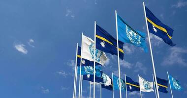 Nauru and United Nations, UN Flags Waving Together in the Sky, Seamless Loop in Wind, Space on Left Side for Design or Information, 3D Rendering video