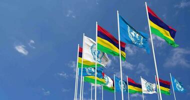 Mauritius and United Nations, UN Flags Waving Together in the Sky, Seamless Loop in Wind, Space on Left Side for Design or Information, 3D Rendering video