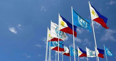 Philippines and United Nations, UN Flags Waving Together in the Sky, Seamless Loop in Wind, Space on Left Side for Design or Information, 3D Rendering video