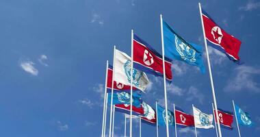 North Korea and United Nations, UN Flags Waving Together in the Sky, Seamless Loop in Wind, Space on Left Side for Design or Information, 3D Rendering video