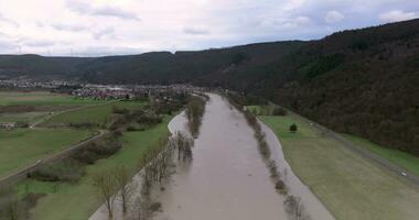 Drone video of the German river Main during a flood with flooded trees on the banks