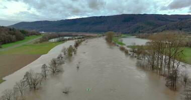 Drone video of the German river Main during a flood with flooded trees on the banks