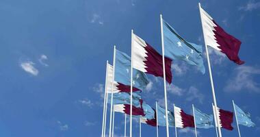 Federated States of Micronesia and Qatar Flags Waving Together in the Sky, Seamless Loop in Wind, Space on Left Side for Design or Information, 3D Rendering video