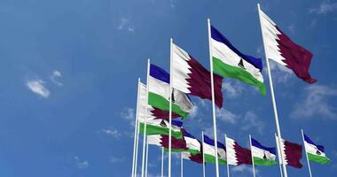 Lesotho and Qatar Flags Waving Together in the Sky, Seamless Loop in Wind, Space on Left Side for Design or Information, 3D Rendering video