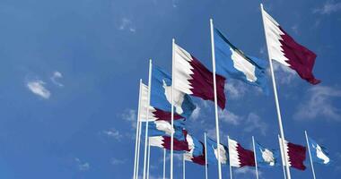 Antarctica and Qatar Flags Waving Together in the Sky, Seamless Loop in Wind, Space on Left Side for Design or Information, 3D Rendering video