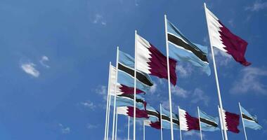 Botswana and Qatar Flags Waving Together in the Sky, Seamless Loop in Wind, Space on Left Side for Design or Information, 3D Rendering video