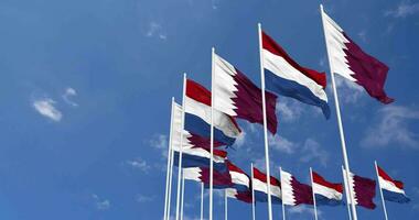 Netherlands and Qatar Flags Waving Together in the Sky, Seamless Loop in Wind, Space on Left Side for Design or Information, 3D Rendering video