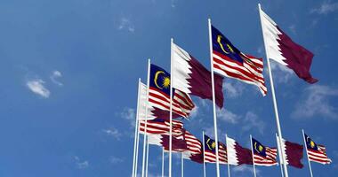 Malaysia and Qatar Flags Waving Together in the Sky, Seamless Loop in Wind, Space on Left Side for Design or Information, 3D Rendering video