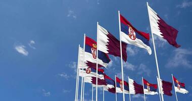 Serbia and Qatar Flags Waving Together in the Sky, Seamless Loop in Wind, Space on Left Side for Design or Information, 3D Rendering video