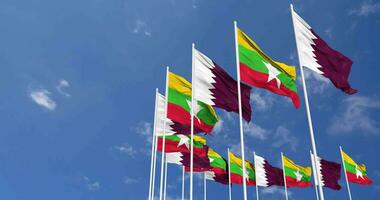 Myanmar, Burma and Qatar Flags Waving Together in the Sky, Seamless Loop in Wind, Space on Left Side for Design or Information, 3D Rendering video