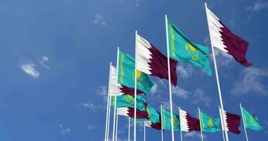 Kasachstan und Katar Flaggen winken zusammen im das Himmel, nahtlos Schleife im Wind, Raum auf links Seite zum Design oder Information, 3d Rendern video