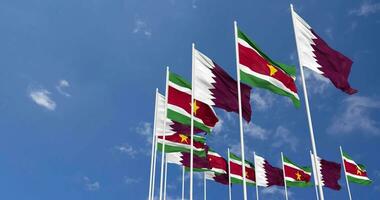 Suriname and Qatar Flags Waving Together in the Sky, Seamless Loop in Wind, Space on Left Side for Design or Information, 3D Rendering video