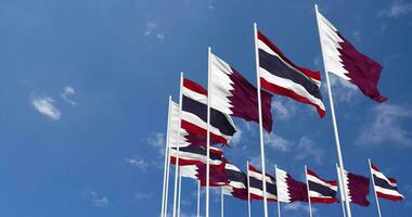 Thailand and Qatar Flags Waving Together in the Sky, Seamless Loop in Wind, Space on Left Side for Design or Information, 3D Rendering video