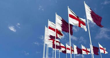 England and Qatar Flags Waving Together in the Sky, Seamless Loop in Wind, Space on Left Side for Design or Information, 3D Rendering video