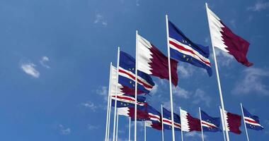 Cape Verde, Cabo Verde and Qatar Flags Waving Together in the Sky, Seamless Loop in Wind, Space on Left Side for Design or Information, 3D Rendering video