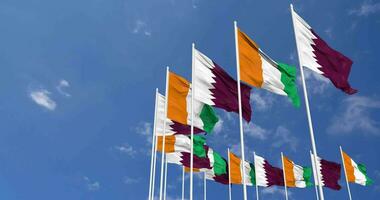 Ivory Coast and Qatar Flags Waving Together in the Sky, Seamless Loop in Wind, Space on Left Side for Design or Information, 3D Rendering video