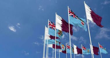 Fiji and Qatar Flags Waving Together in the Sky, Seamless Loop in Wind, Space on Left Side for Design or Information, 3D Rendering video