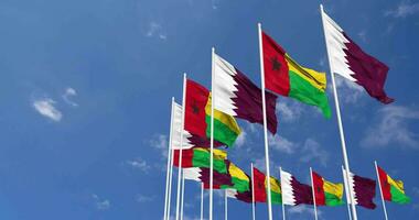 Guinea Bissau and Qatar Flags Waving Together in the Sky, Seamless Loop in Wind, Space on Left Side for Design or Information, 3D Rendering video