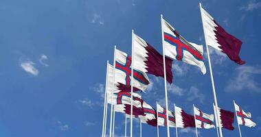 Faroe Islands and Qatar Flags Waving Together in the Sky, Seamless Loop in Wind, Space on Left Side for Design or Information, 3D Rendering video