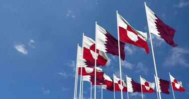 Greenland and Qatar Flags Waving Together in the Sky, Seamless Loop in Wind, Space on Left Side for Design or Information, 3D Rendering video