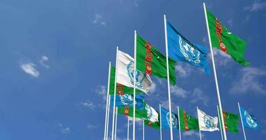 Turkmenistan and United Nations, UN Flags Waving Together in the Sky, Seamless Loop in Wind, Space on Left Side for Design or Information, 3D Rendering video