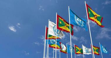 Grenada and United Nations, UN Flags Waving Together in the Sky, Seamless Loop in Wind, Space on Left Side for Design or Information, 3D Rendering video