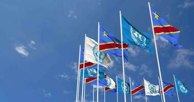 DR Congo and United Nations, UN Flags Waving Together in the Sky, Seamless Loop in Wind, Space on Left Side for Design or Information, 3D Rendering video