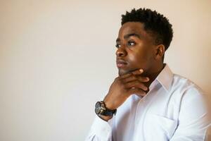 Portrait of young businessman who is thoughtful and worried. photo