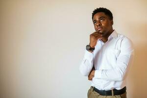 Portrait of young businessman who is thoughtful and worried. photo