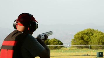 Alhaurin de la Torre, 2017 - Shooter man aiming and firing a rifle in a competition of skeet. video