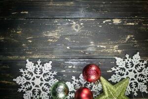 Christmas Holiday Ornaments on a Dark Wood Background. photo