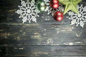 Christmas Holiday Ornaments on a Dark Wood Background. photo