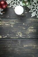 Christmas Holiday Ornaments on a Dark Wood Background. photo