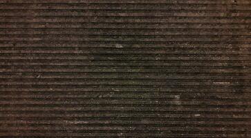 Brown ribbed corduroy background and texture photo