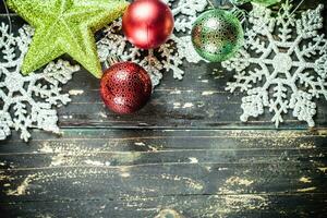 Christmas Holiday Ornaments on a Dark Wood Background. photo