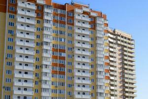 A new multi-storey house. Construction of residential apartments. Floors of the apartment house photo