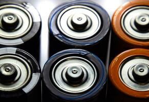 Salt and alkaline batteries, source of energy for portable technology. AAA and AA batteries photo