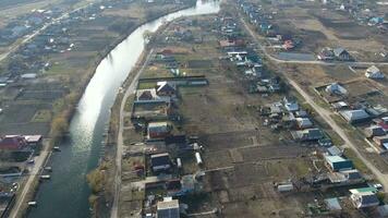 View from the top of the village. Streets without asphalt and single-storey houses. The Kuban village. photo