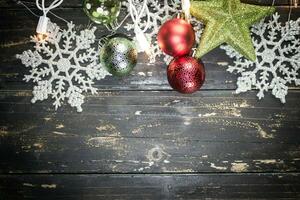 Christmas Holiday Ornaments on a Dark Wood Background. photo