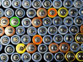 Salt and alkaline batteries, source of energy for portable technology. AAA and AA batteries photo