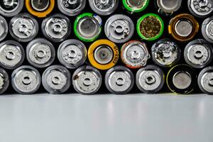 Salt and alkaline batteries, source of energy for portable technology. AAA and AA batteries photo