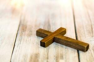 Holy Christian Wooden Cross on White Washed Background photo