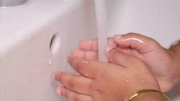 child washing hands with soap video