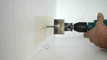 slow motion of using electric drilling on white wooden board video