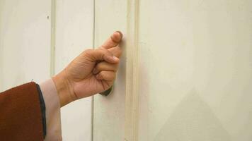 Women Hand knocking on door. video