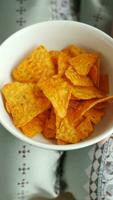 top view of women hand pick potato chips from a bowl video