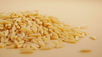 closeup of brown long rice on table . video