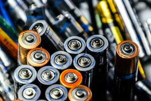 Salt and alkaline batteries, source of energy for portable technology. AAA and AA batteries photo