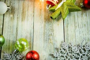 Christmas Holiday Lights and Ornaments on Wood Background photo