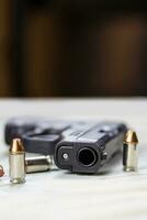 Pistol Handgun and Bullets photo